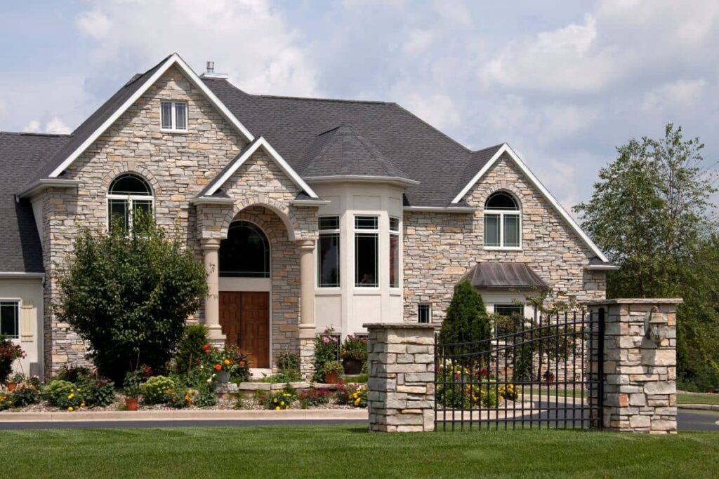 Custom stone and brick masonry on a Texas home in Frisco TX, built to withstand the Texas climate